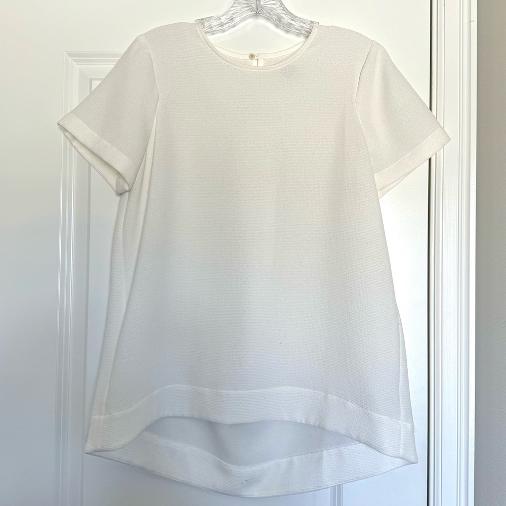 Madewell short sleeve blouse pleated back high low hem cream
